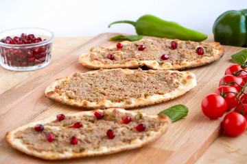 Meat with dough, manakeesh meat, arabic flat bread with meat. Close up