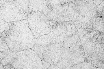 Fototapeta premium Texture of a concrete wall with cracks and scratches which can be used as a background