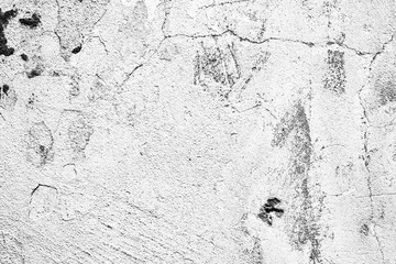 Texture of a concrete wall with cracks and scratches which can be used as a background