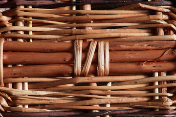 Beautiful wooden wattle fence lit by the rays of the sun, background for decorating your interior.
