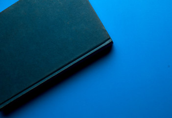 old book blue color, on blue background classic  