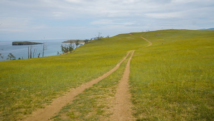 landscape with a view of the outgoing road along the green coast