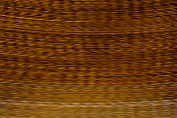 Obraz premium Defocused of blurred lush lava orange speed line light in the dark night for abstract background texture patterns