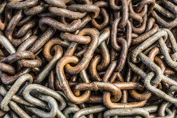 Random Chain background, piled chained links of various size and rusted patina.