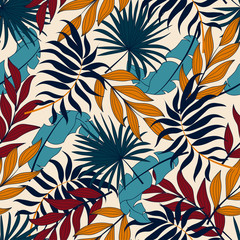 Tropical seamless pattern. Colorful plants and leaves on a light background. Vector background for various surface. Exotic wallpaper, Hawaiian style. Jungle leaves. Botanical pattern.