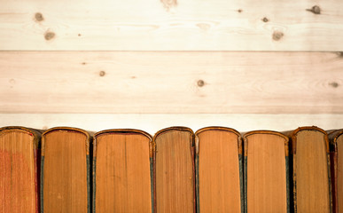Collection of old books on wooden background
