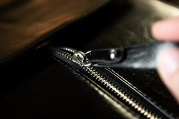 Black leather detail handbag with metal lock zipper © Natallia