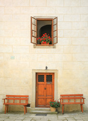 Fototapeta na wymiar building interior with red flowers on the window