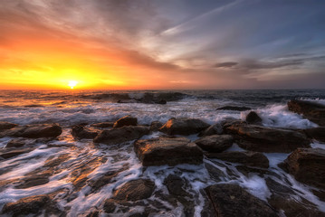 Stunning long exposure seascape with the colorful sky over the water