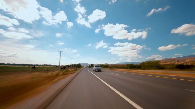 Time-lapse of driving fast speed a car on countryside road Thailand in the day time, POV shot 4k