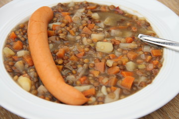 delicious freshly made lentil soup with a sausage