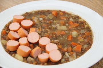 delicious freshly made lentil soup with a sausage