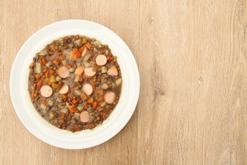 delicious freshly made lentil soup with a sausage