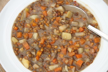 delicious freshly made lentil soup with a sausage