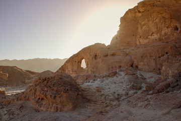 The famous Timna National Park in the desert in southern Israel in the Eilat region. Sand cliffs, dry land, red sand in the form of pillars and mushrooms. Sights of Israel.