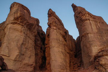 The famous Timna National Park in the desert in southern Israel in the Eilat region. Sand cliffs, dry land, red sand in the form of pillars and mushrooms. Sights of Israel.