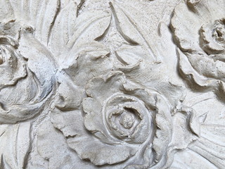 Low relief cement Thai style handcraft of rose flower