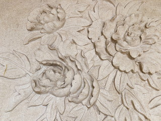 Low relief cement Thai style handcraft of rose flower
