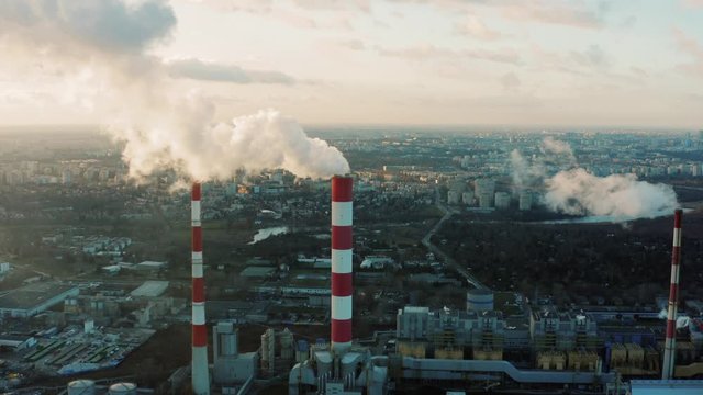 Aerial view of a coal-fired power plant in winter. Production of electricity with fossil fuel. Poor Environment City. Environmental Disaster. Climate Change Theme