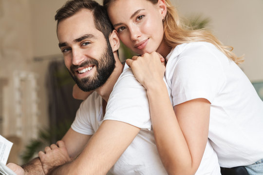 Lovely smiling young couple embracing