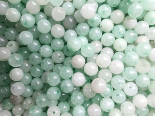 Close up small green beads background.