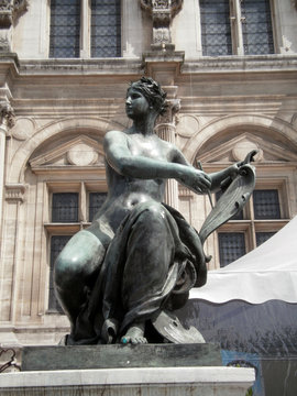 Paris, France - June 23th 2012 : Focus on a bronze sculpture on the parvis of the town hall of Paris. It's the allegory of Arts by Laurent Marqueste.