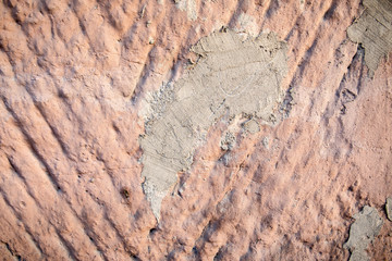 Exterior wall repair. Damaged by cracks. Textured background