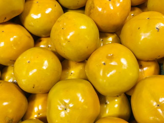 Persimmons fruit at the farmers market