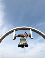 Brass metaled big bell with sky background