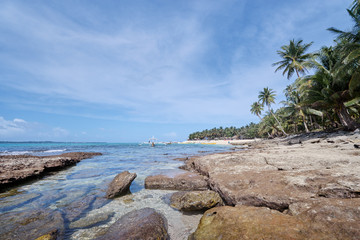 Beautiful tropical seascape with traditional philippinean fishing boat.