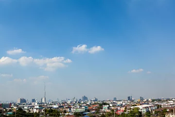 Fotobehang the city beautiful blue sky and white clouds background and wallpaper design ideas © prasit