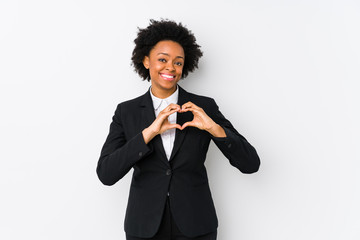 Middle aged african american business  woman against a white background isolated smiling and...