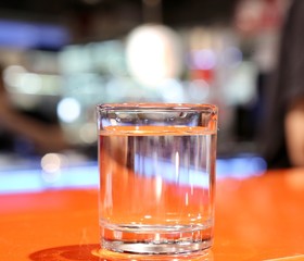glass of whiskey and ice on table