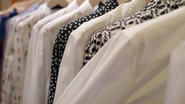 Close-up of woman's hands shopping for new clothes