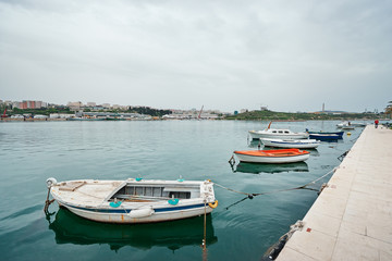 Fototapeta na wymiar Harbor with leisure and fishing boats at anchor,