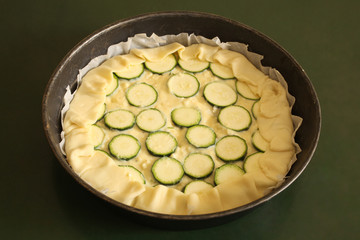 zucchine raw savory cake ready for the oven with copy space for your text