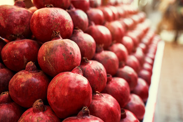 Group of pomegranates. Pomegranate closeup, background.