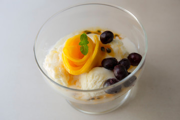 icecream, mango decoration flower and frozen berries
