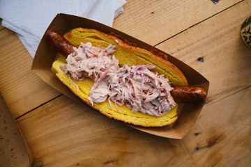 Hot dog sandwich with coleslaw salad, delicious street food