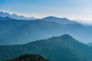 Fototapeta premium Kerala Mountain Landscape View foggy Forest and blue sky beautiful travel spot in Kannur Palakkayam Thattu God's own Country