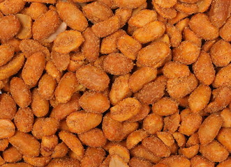 Spicy peanuts pile background and texture, top view