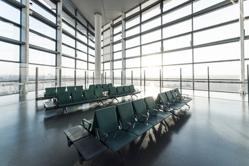 Chairs in modern airport terminal