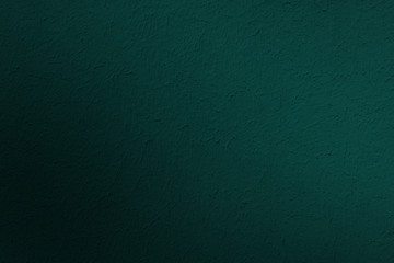 Dark mysterious background, stucco texture on an old wall. Shade trend, fashionable eden.