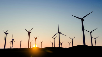 Wind Turbine on Grass at Sky Background