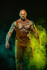 Fototapeta premium Muscular fitness sports man, atlete with chains in fitness gym. Energy and power.