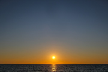 Naklejka premium Perfect burning sunset sea horizon in cilento south of italy, nature backgrounds