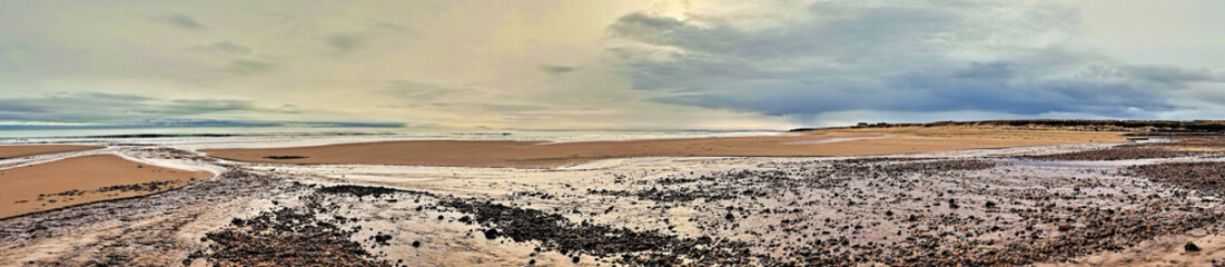 Brora beach at the first burn with the tide out looking south towards Brora