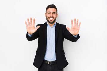 Young caucasian business man against a white background isolated showing number ten with hands.