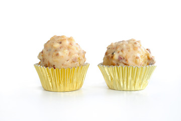 Homemade white chocolate almond balls on white background