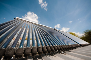 Vacuum solar water heating system on the house roof.
